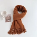 Flat lay of soft caramel cashmere-feel scarf with tassels next to a cozy coffee cup - Regular Fit / Coffee