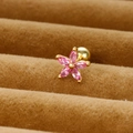 Macro shot of pink zircon flower stud earrings with a gold-plated screw back closure - Gold/Pink Zirconia