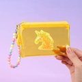Detalle de monedero de unicornio amarillo con lentejuelas brillantes y asa de cuentas - Amarillo