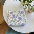 Floral print cotton makeup bag in cream white with blue and purple flower patterns - Blue Floral