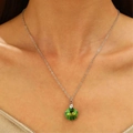 Silver necklace featuring a green faceted crystal wave pendant on a delicate chain - Green Iridescent Crystal Style (N-873)