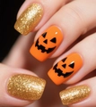 Macro shot of Halloween square nails with orange pumpkin face and gold glitter finish - Gold Glitter Pumpkin Style (CW747)