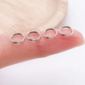 Silver split jump rings for jewelry making shown on a finger for size reference - Double Layer-0.7x5mm / White Gold