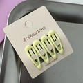 Set of four light green teardrop hair clips on beige accessories card display - Light Yellow