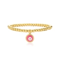 Detail of gold beaded bracelet featuring a pink enamel evil eye charm with gear edge - Pink