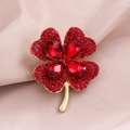 Elegant gold clover brooch with red faceted rhinestones on pink silk fabric - Gold Red Rhinestone Clover (9348-1)
