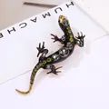 Vintage style lizard brooch featuring black enamel and sparkling green gemstones - Black Enamel Lizard