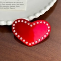 Sparkling red heart acetate hair clip with rhinestones displayed on a wooden surface - Hair Clip / Red
