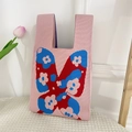 Pink knitted tote bag with a colorful butterfly floral pattern and woven handle - Butterfly-Lotus Pink