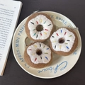Three handmade wool felt doughnut keychains with colorful sprinkles and white icing finish - White Donut Trio