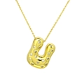 Macro detail of golden balloon initial U pendant necklace with inlaid cubic zirconia - Letter U / Gold