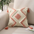 Detail of bohemian tufted cushion cover with orange diamond patterns and corner tassels - Orange White Diamond Tufted
