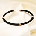 Black braided stainless steel cable bracelet featuring five rose gold cylindrical accents - Rose Black