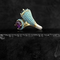 Macro detail of gothic ring with purple amethyst stones and turquoise bead inlay - US 5 / Blue Rhinestone