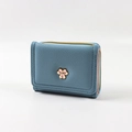 Blue lychee pattern trifold wallet featuring floral hardware and zip coin pocket - Blue