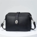 Black pebbled leather crossbody bag with three zipper compartments and silver turn-lock - Black