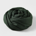 Solid deep green cotton linen scarf folded into a rose shape for professional display - Dark Green