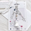 Cute flocked puppy keychain with blue beads and star charms on white plush background - Grey/White
