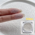 Micro 0,6mm zilveren metalen nail art kralen op vingertoppen voor maatvergelijking - 0.6mm Zilver ca. 5g