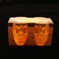 Set of two orange skull-shaped glowing glasses in a Halloween themed gift box - Orange
