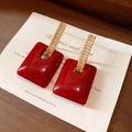 Close-up of geometric square red earrings with gold zirconia accents on a wood surface - Red Square Hollow Diamond Earrings (10#) / Red
