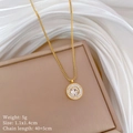 Macro shot of gold-plated circular pendant with embedded crystals and product measurements - Gold Necklace (M207 Gold)