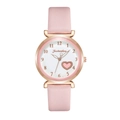Detail view of pink leather strap and rose gold watch case with heart pattern dial - Pink