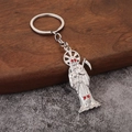 Portachiavi Santa Muerte in argento con falce e strass rossi sugli occhi del teschio - Argento