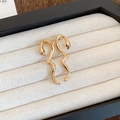 Elegant gold-tone snake earrings with textured detail on cream display pad - Scaly Texture Snake Stud / Gold