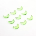 Close-up of translucent green crescent moon glass charms with glitter and hanging holes - Gold Powder Grass Green