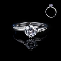 Elegant silver twisted band moissanite ring with a brilliant round six-prong solitaire setting - Adjustable Open / Holding Hands Six-Prong Twisted Pave (1 Carat Effect)