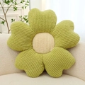 Avocado green flower-shaped corduroy pillow with cream center on white sofa - Green