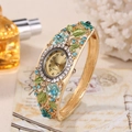 Vintage cloisonne quartz bangle watch with blue crystal flowers and green enamel leaves - Blue