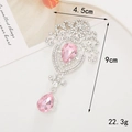 Detailed view of silver flower pendant with pink pear-shaped gems and rhinestones - Silver Base Pink Waterdrop Pendant