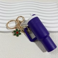 Purple Stanley style tumbler keychain with white lid and small green snowflake charm - Christmas Dark Purple