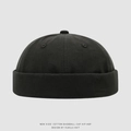 Détail d'un bonnet docker noir pour enfants avec bord roulé sans bordure et bouton supérieur - 52cm (2-5 Ans) / Vert Foncé