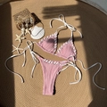 Pink ribbed bikini set with adjustable side-tie bottoms and seashell beach background - S / Pink