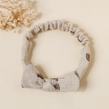 Detailed macro view of soft cotton baby headband featuring rainbow prints and a cute knot - Grey Rainbow