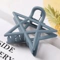 Matte greyish-blue hollow star hair claw clip with frosted texture in a side view - 7.5cm / Gray