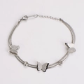Macro detail of silver double-layer chain bracelet with frosted butterflies and rhinestones - Steel