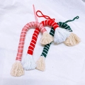 Three handmade woven candy cane Christmas tree ornaments in pink, red, and green cotton - Red