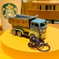 Cartoon dinosaur dump truck keychain featuring a blue cab, yellow chassis and silver bell - Pull-back Dinosaur Engineering Vehicle - Transport Truck