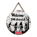 Detail of round Halloween wooden welcome sign with zombie and dry tree silhouettes - Style J-Welcome You Should Leave and Zombie