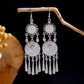 Ethnic bohemian silver tassel earrings with hollow carved details on a wooden branch - Multi-layer Hollow Carved Silver Tassel Style (E2871-12)