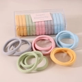 Macro shot of 15 high-elasticity hair ties in pastel colors with a clear storage box - Color B Mixed Style (Boxed)
