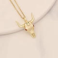 Close-up of golden bull skull pendant with red gemstone eyes on a micro-set zircon chain - Vintage Red Ruby Eye Bull Skull Style (18#)