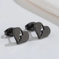 Macro detail of glossy black broken heart stud earrings in minimalist irregular design - 527 Broken Heart - Black