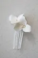 Detailed macro of white ceramic flower petals with fresh water pearls on bridal hair comb - Silver