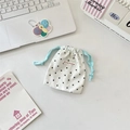 Detail of white cotton drawstring pouch with black polka dots and light blue strings - Small / Mint Green Rope