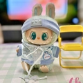 Art toy figure in green plush with blue checkered hoodie and a light blue knit hat - Light Blue Trendy / First And Second Generation Keychains Are Compatible With La Cloth Dolls. Dolls Not Included.